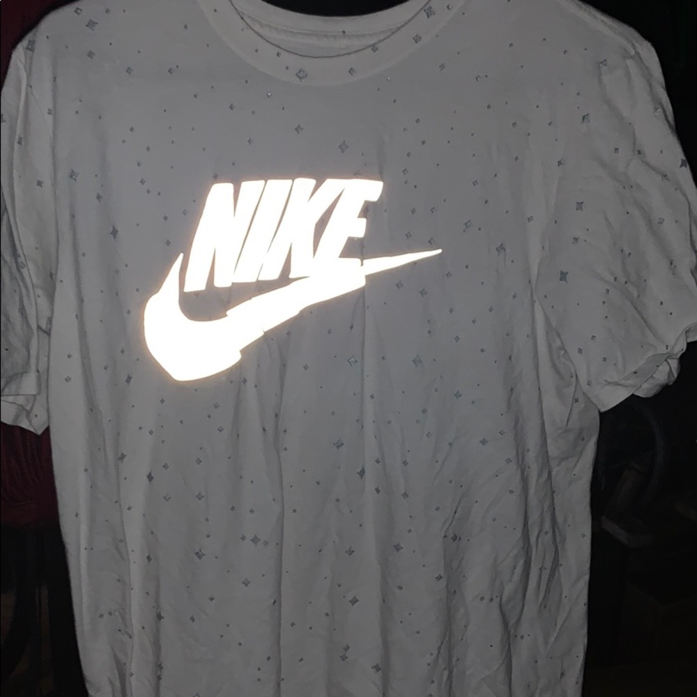 Nike shirt with flash light sensitive swoosh